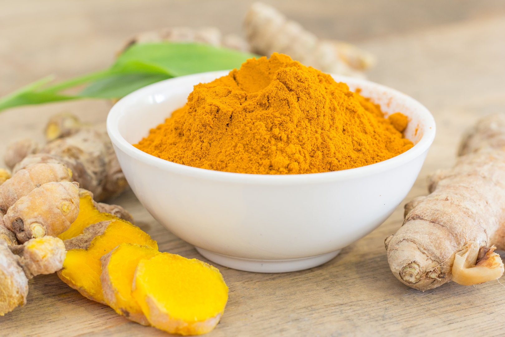 Golden turmeric powder and root, the natural source of liposomal curcumin used intravenously