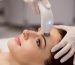 Patient receiving a Laser Genesis facial treatment with a handheld Nd:YAG laser